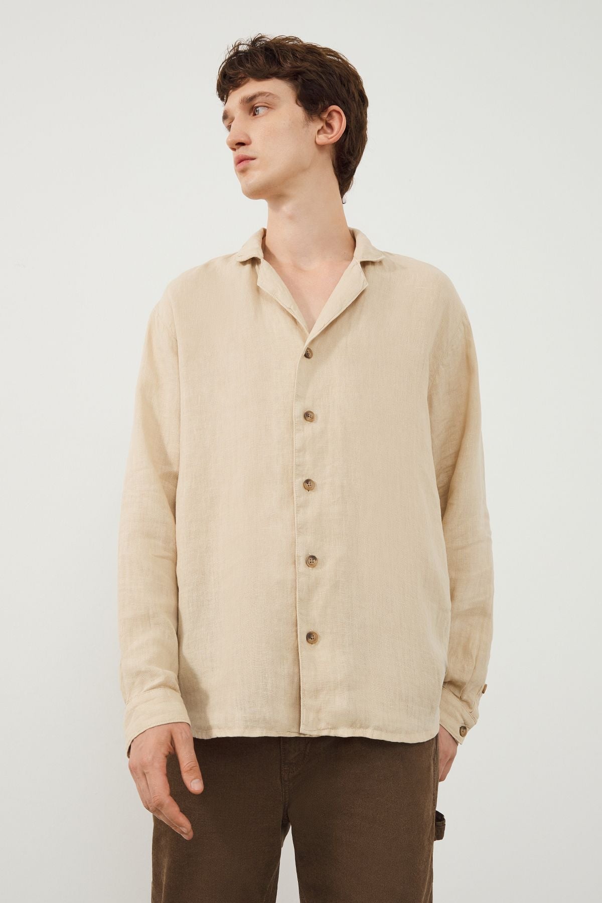 Style Inspiration: Young Man Wearing TENEDOS Beige Linen Shirt by Ra Denim with Khaki Carpenter Trousers