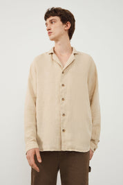 Style Inspiration: Young Man Wearing TENEDOS Beige Linen Shirt by Ra Denim with Khaki Carpenter Trousers