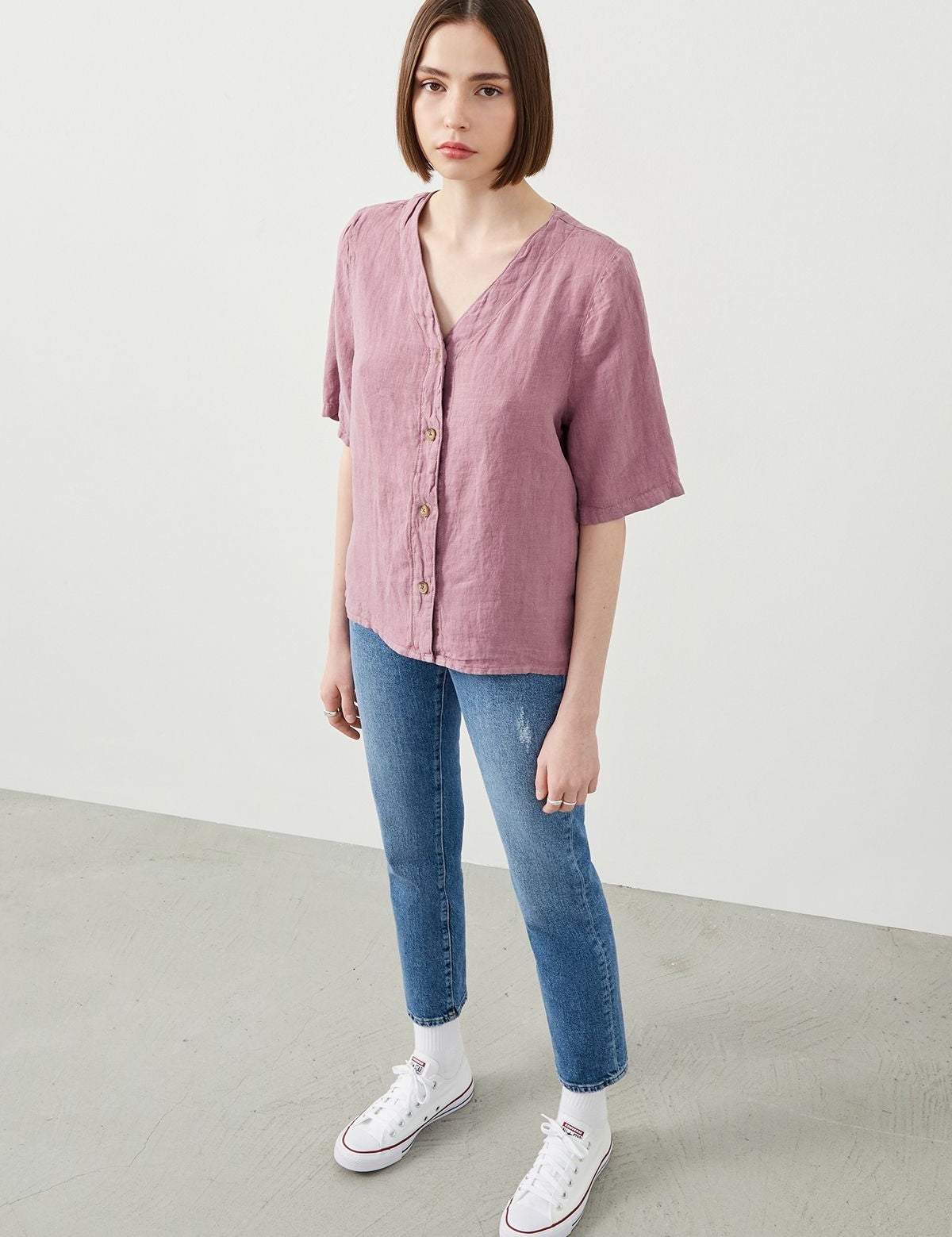 Model Wearing Sora Purple Linen Shirt with blue jeans and white sneakers