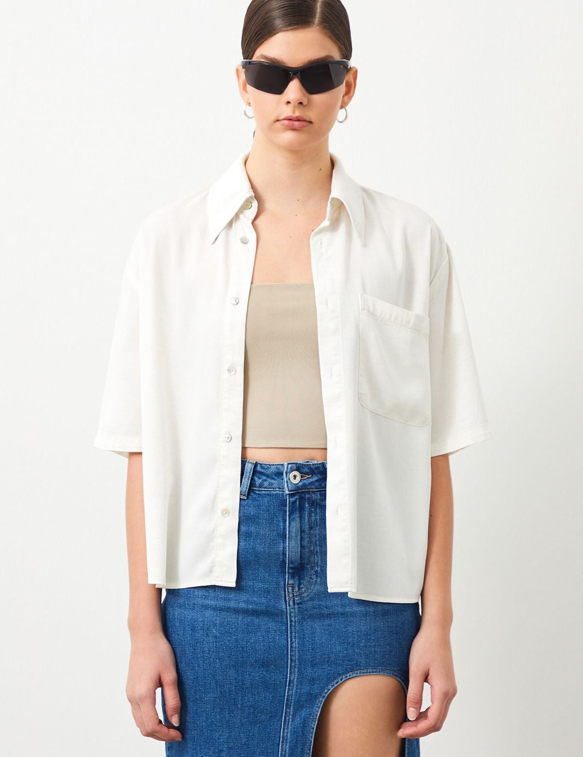 Woman wearing the POENA Ecru Shirt by sustainable fashion brand Ra Denim.