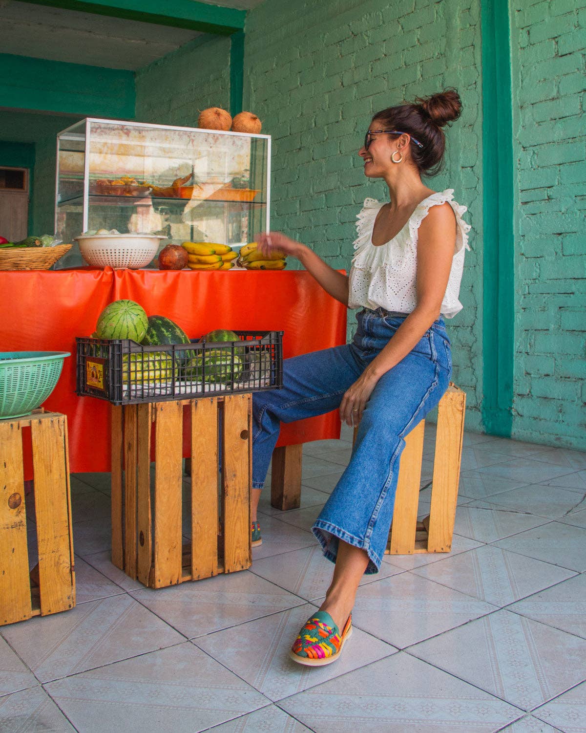 MEXAS braided leather loafers styled with a blouse and jeans.