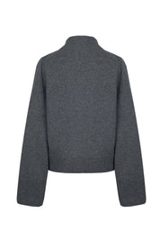 Back view of a grey cashmere sweater by Nuage Cashmere, featuring wide sleeves and a high neck in a soft, knitted design