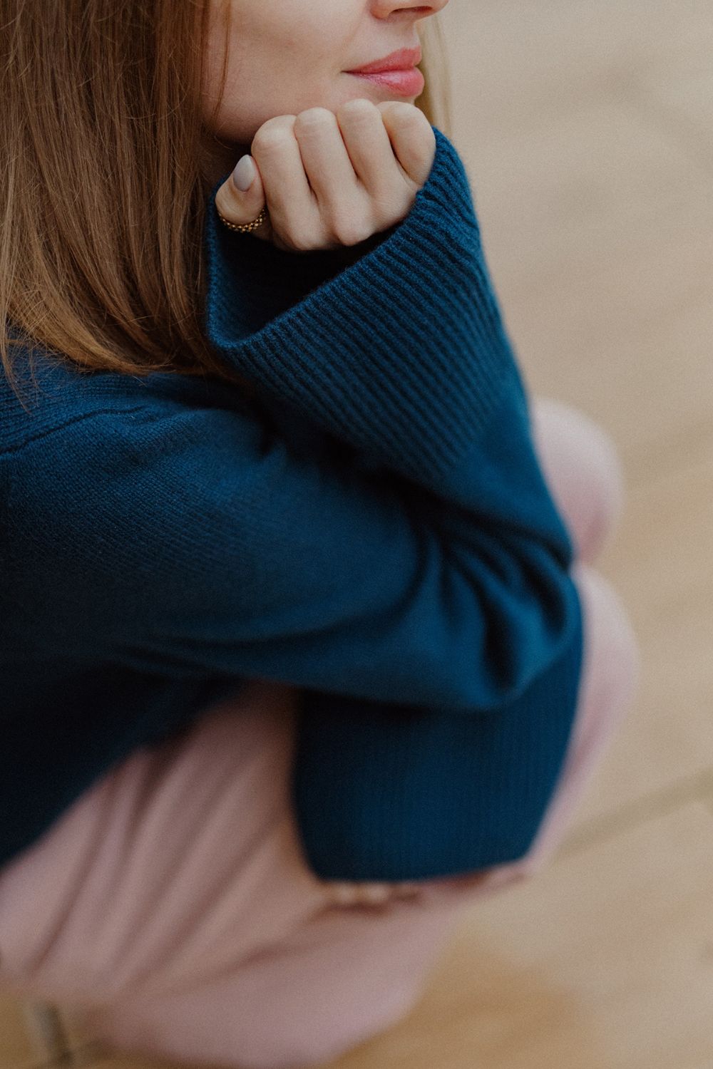 Close-up of a petrol blue cashmere sweater by Nuage Cashmere, showcasing the soft, knitted texture of 100% Italian cashmere