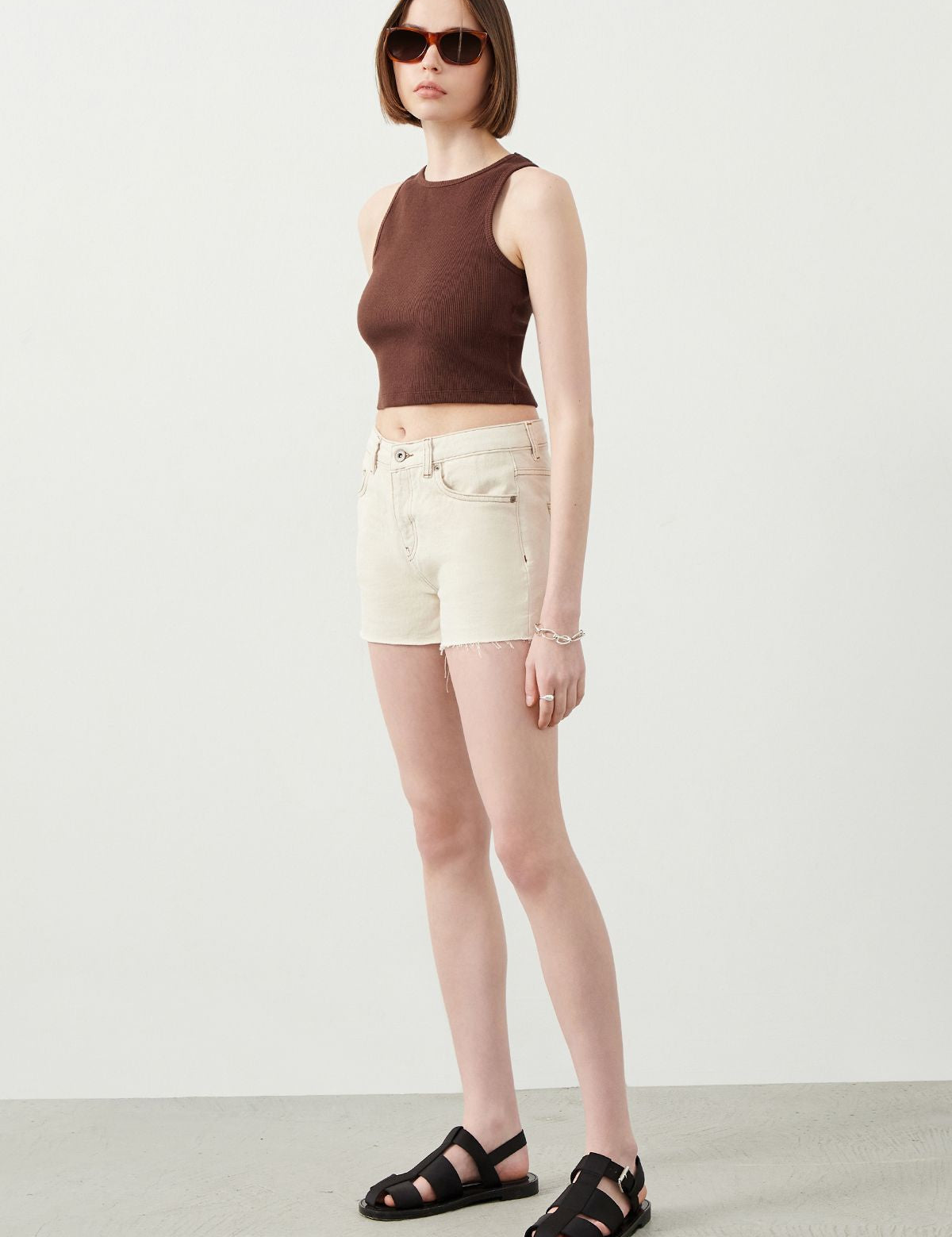Stylish Look created with Ecru Denim Shorts, black sandals and cool sunglasses for a great summer outfit