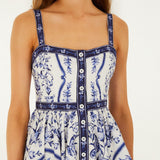 Detailed view of the hand-painted floral print and buttoned front on the Farm Rio Porcelain Garden mini dress