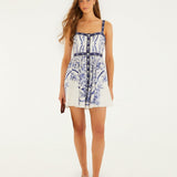 Back view of a model wearing the Farm Rio off-white Porcelain Garden mini dress