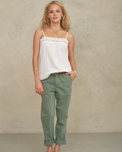 Front view of a model posing in a white bohemian-style cotton camisole from Mabe Apparel.