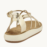Back view of the Anastasia Comfort platinum sandal showing the adjustable ankle strap and heel