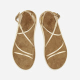 Top view of a pair of Anastasia Comfort platinum sandals with crossover metallic straps and suede-lined footbeds