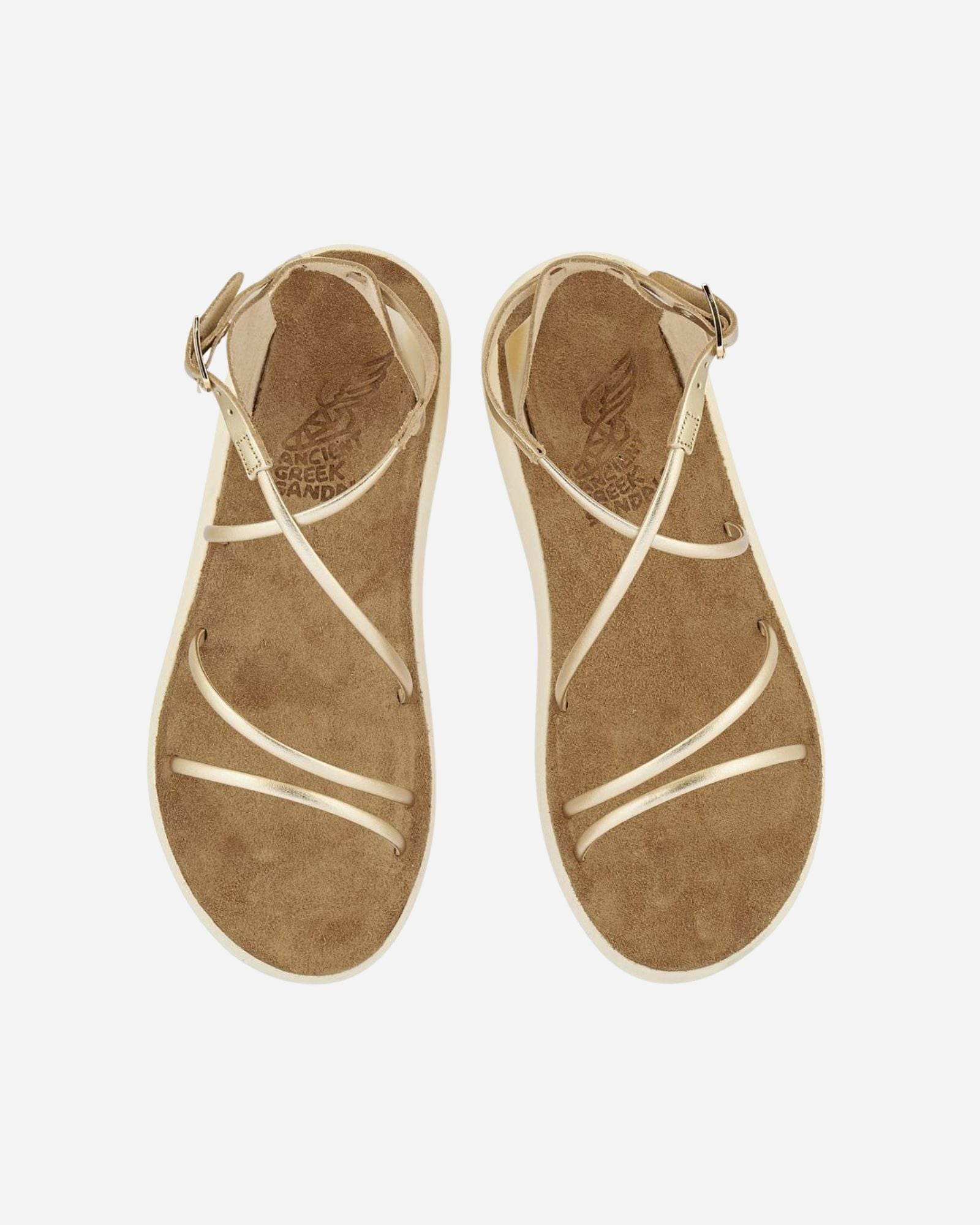 Top view of a pair of Anastasia Comfort platinum sandals with crossover metallic straps and suede-lined footbeds