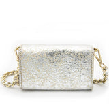 A back-facing view of the Ary Bag, showcasing its silver sheepskin leather