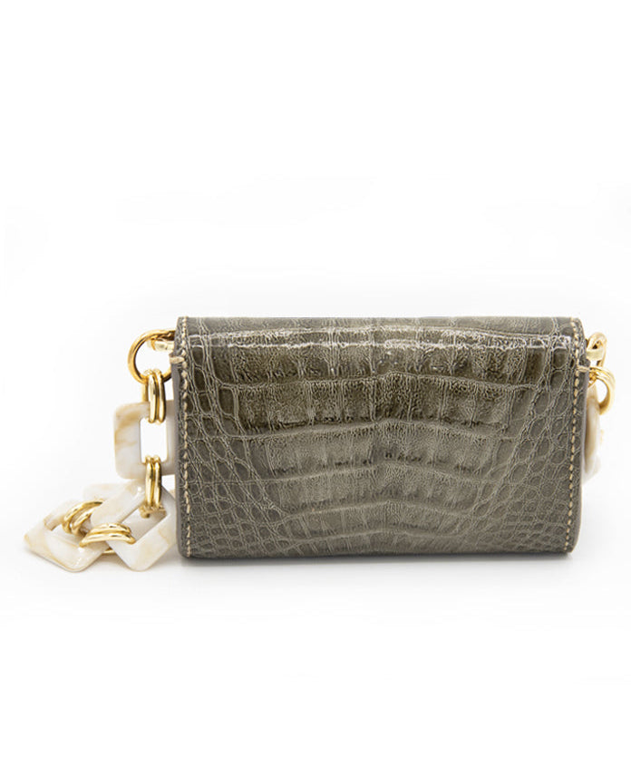 Exclusive Aetalia Ary shoulder bag, handmade in Elba from olive leather with a crocodile print—combining luxury and timeless elegance.