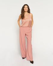 MMAstrid Silk Tank Top in peach with relaxed wide-leg trousers