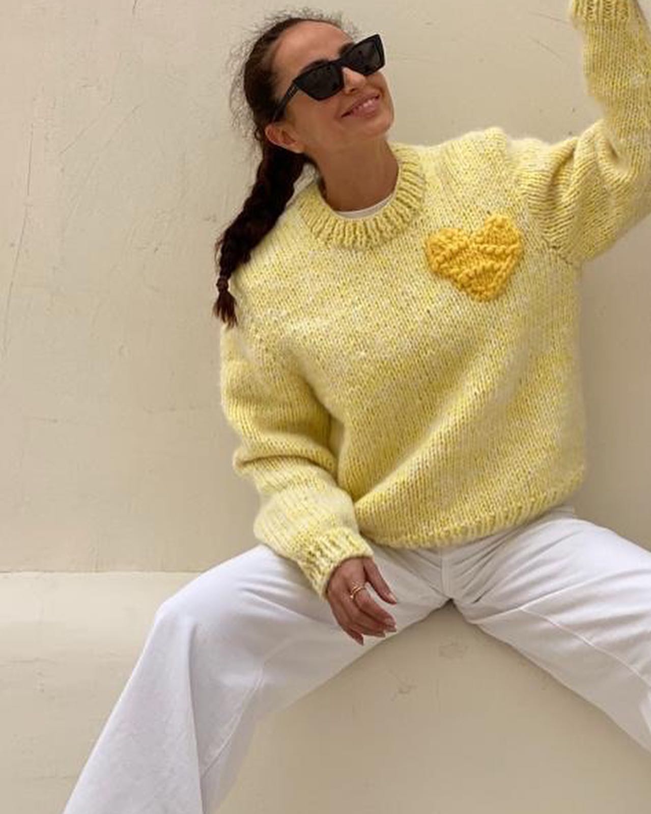 Hand-knitted yellow pullover with yellow heart by Atelier 8/02, made from Merino and Alpaca wool.