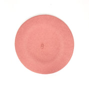  100% merino wool beret in pink, showcasing its hand-embroidered details and luxurious texture