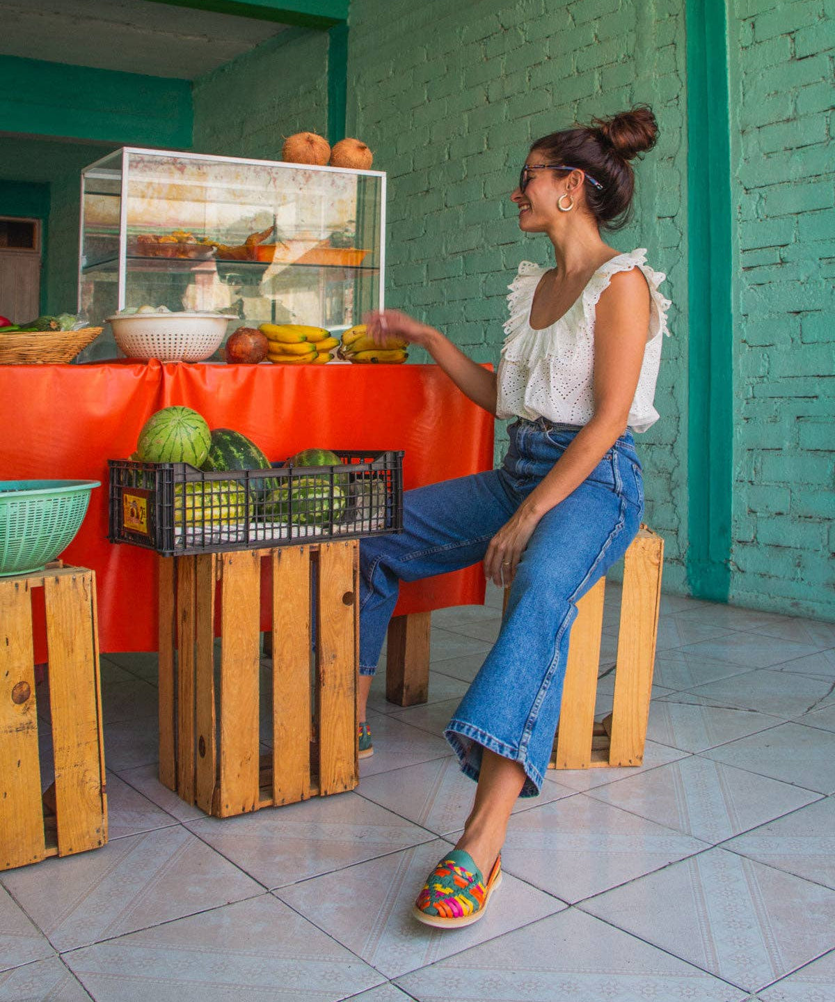 MEXAS braided leather loafers styled with a blouse and jeans.