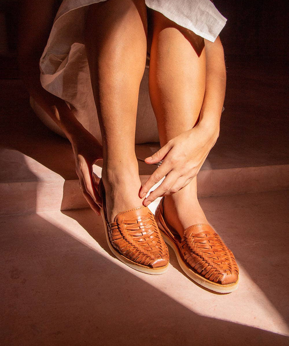 Woman wearing the SAHUAYO huaraches, showcasing their flexible and comfortable fit.