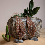Mayana Designs Beaded Handwoven Taos Fringe Earrings in Light Brown on display. Highlighting the intricate beadwork and fringe design