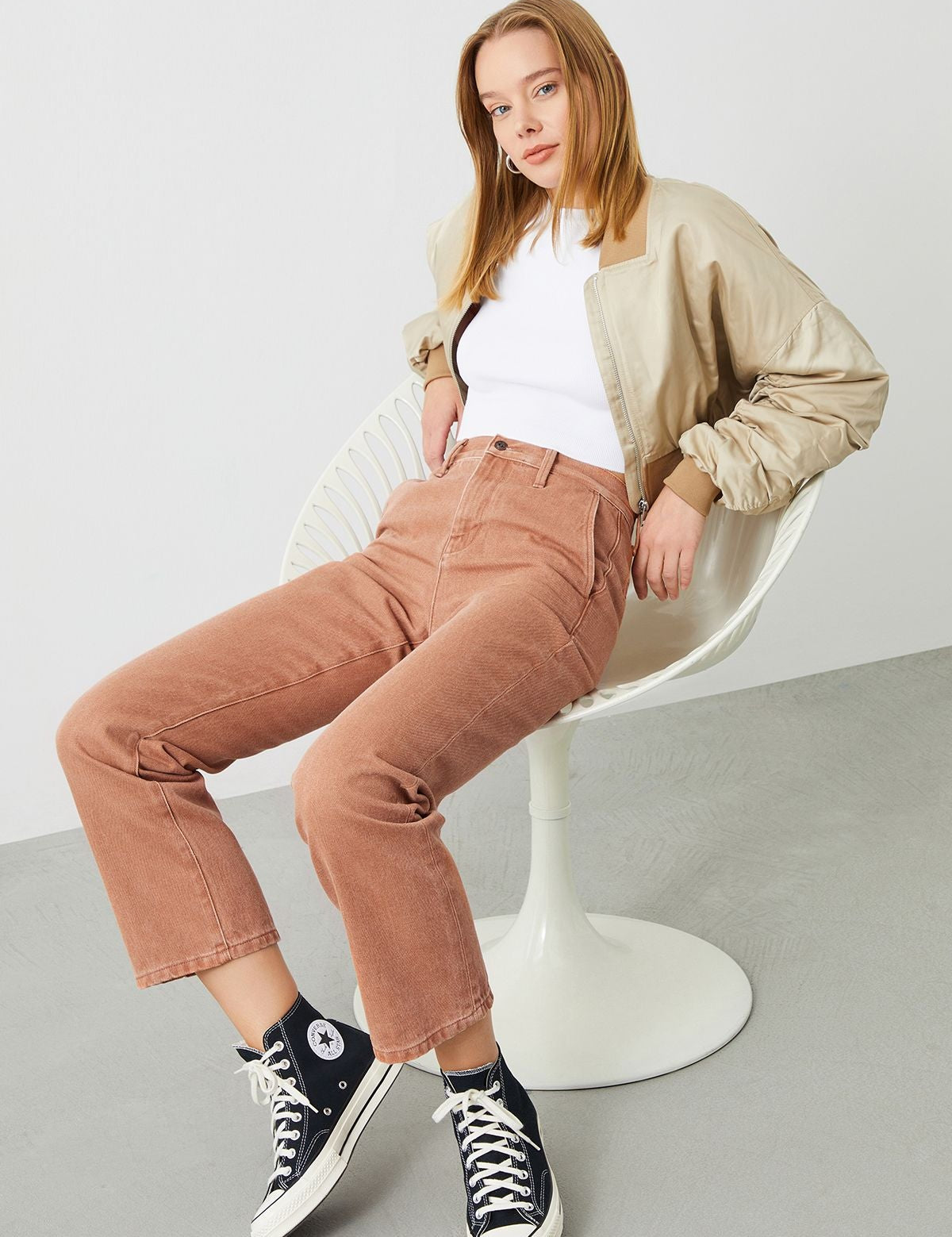 Stylish woman wearing the Mira Boyfriend Fit Chino Pant in Terracotta