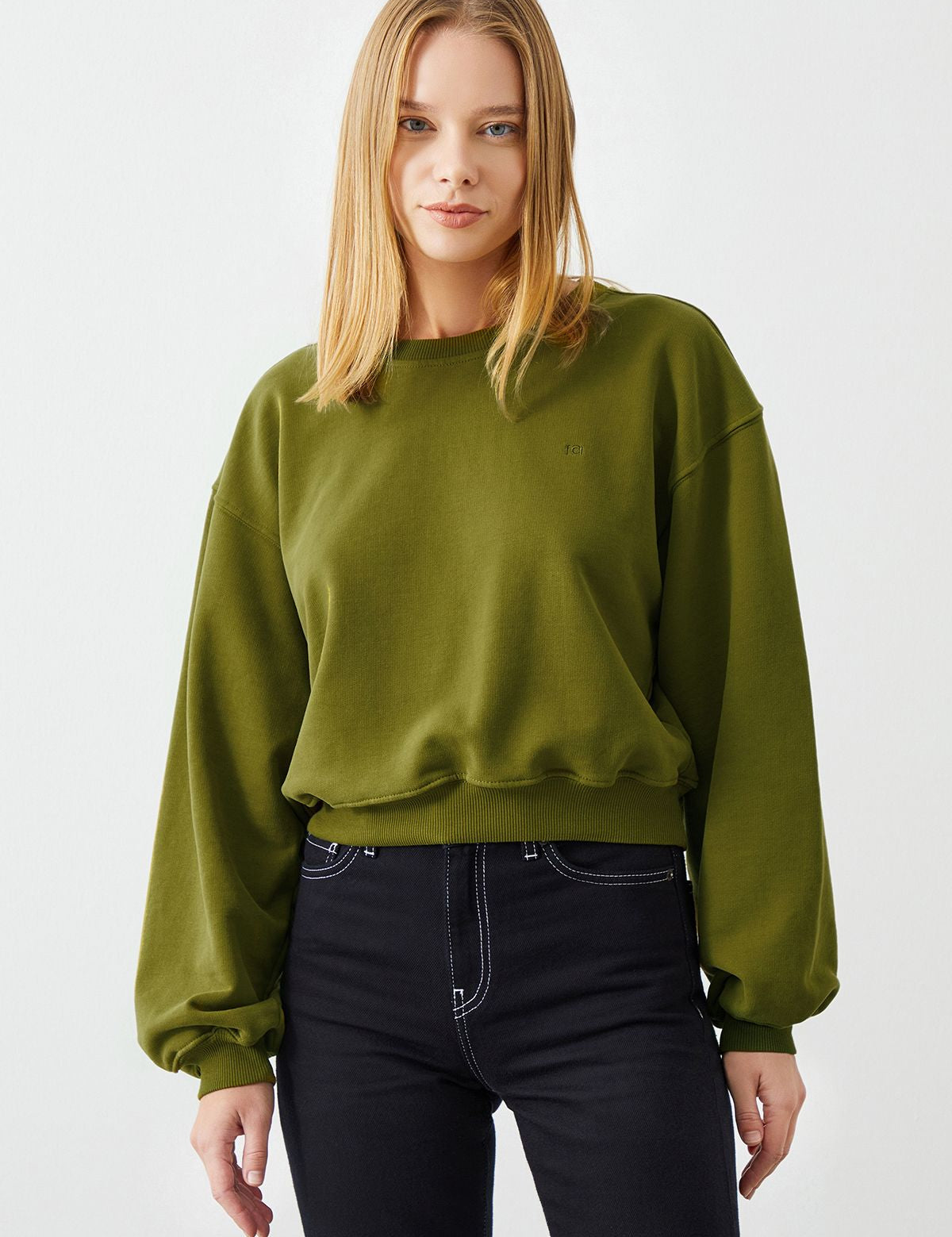 Eco-Conscious Woman Wearing VITA Avocado Crop Sweatshirt - Stylish and Sustainable