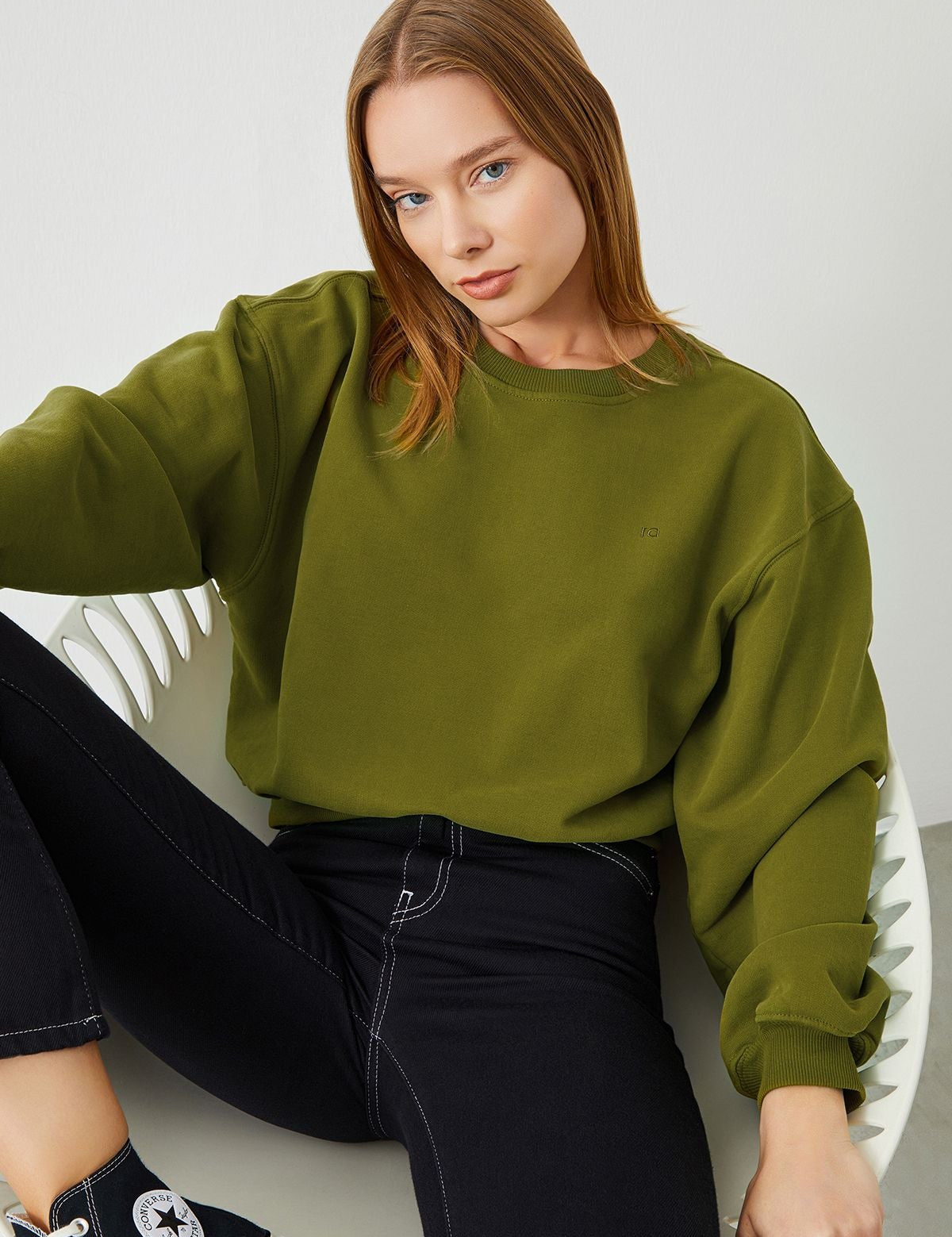Stylish Woman in Green VITA Avocado Crop Sweatshirt - Fashionably Eco-Friendly
