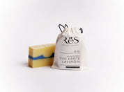 A bar of moisturizing soap made with extra virgin olive oil and shea butter, scented with lavender essential oil