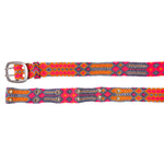 Handwoven Adriana Peppy Belt by Smitten in grey and pink, laid flat with geometric patterns and sturdy metal buckle