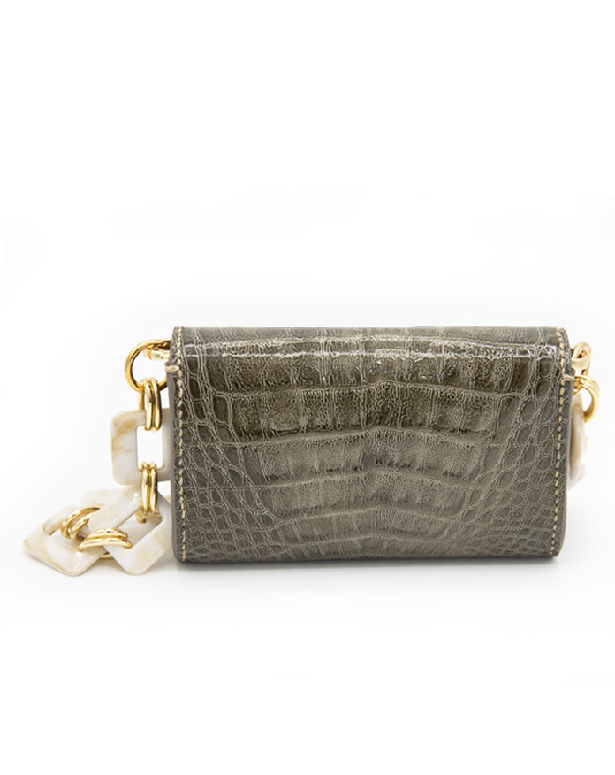 Exclusive Aetalia Ary shoulder bag, handmade in Elba from olive leather with a crocodile print—combining luxury and timeless elegance.