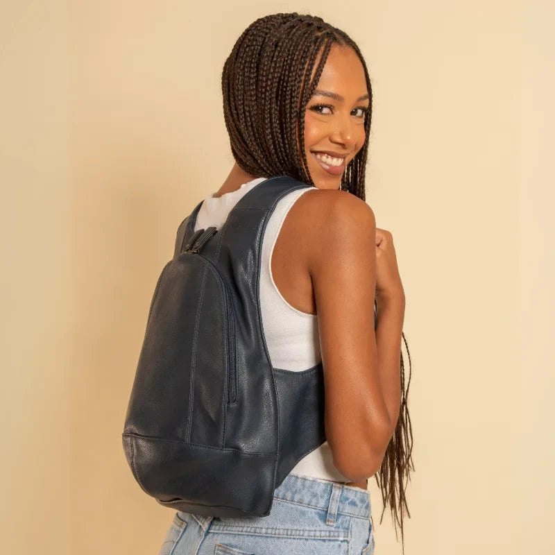Model wearing the ARSAYO Original vegan backpack in dark blue