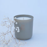 BYKOKO Serene Ritual scented candle styled with dried flowers