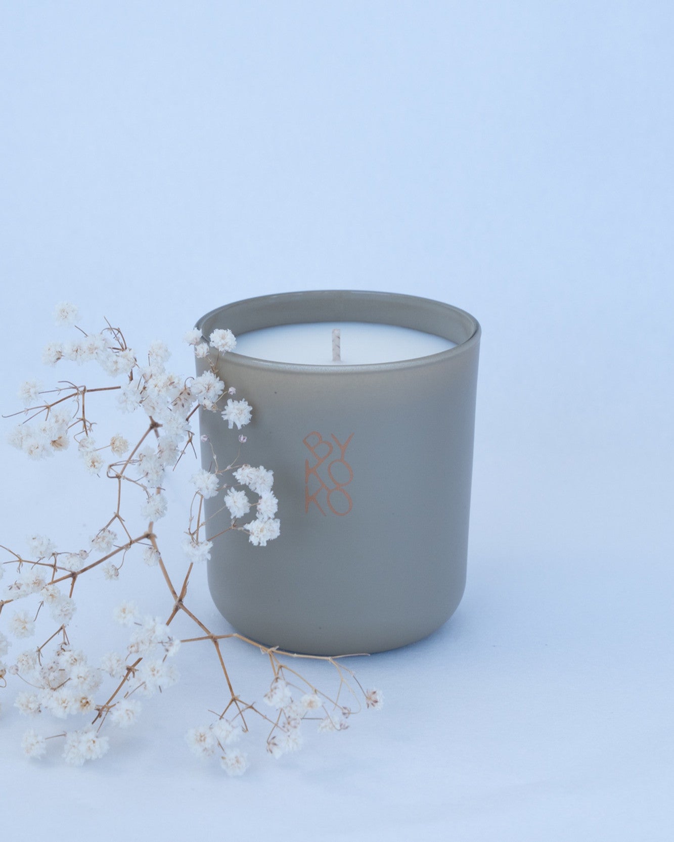 BYKOKO Serene Ritual scented candle styled with dried flowers