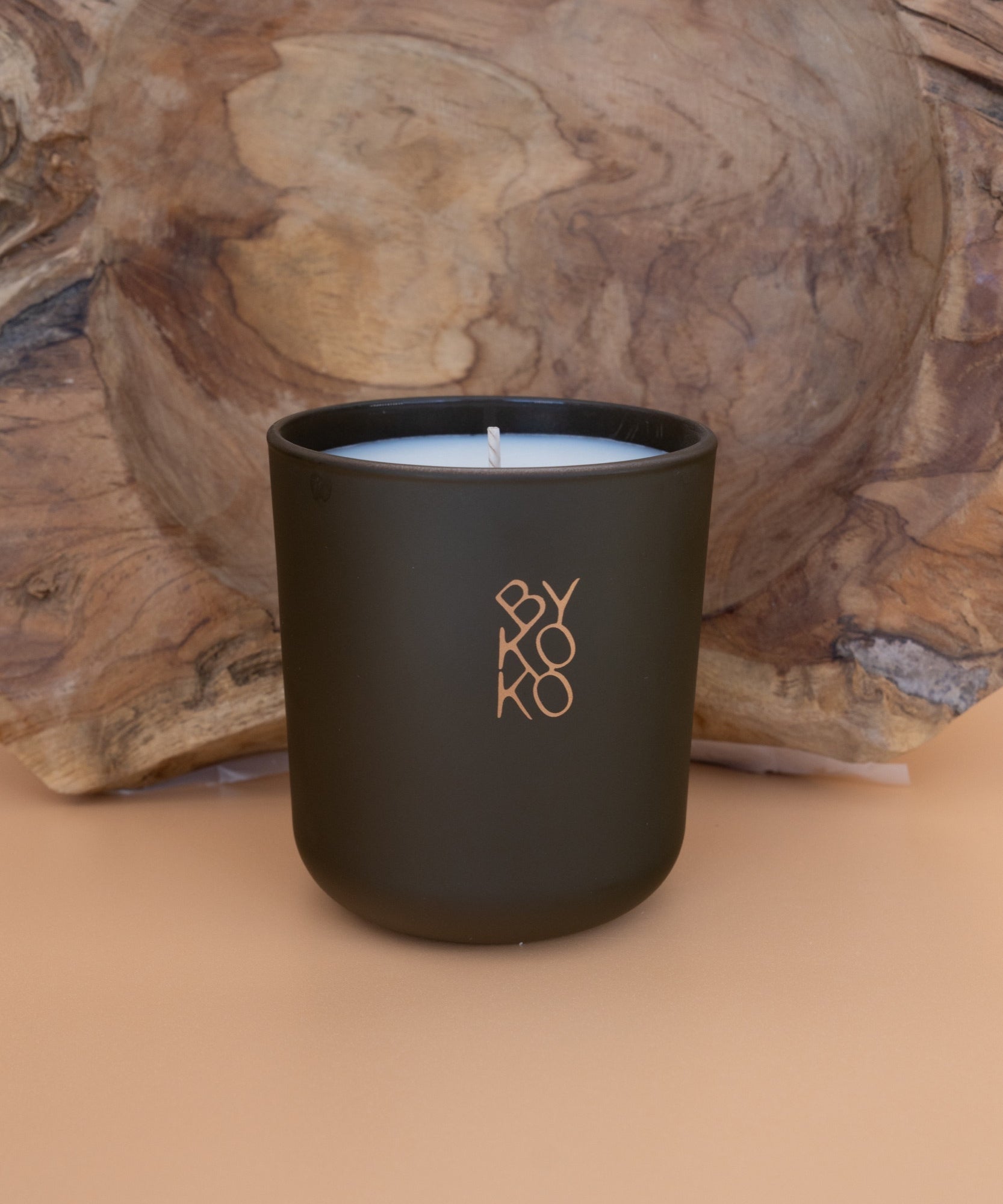 BYKOKO Swiss Chalet scented candle on a wooden backdrop