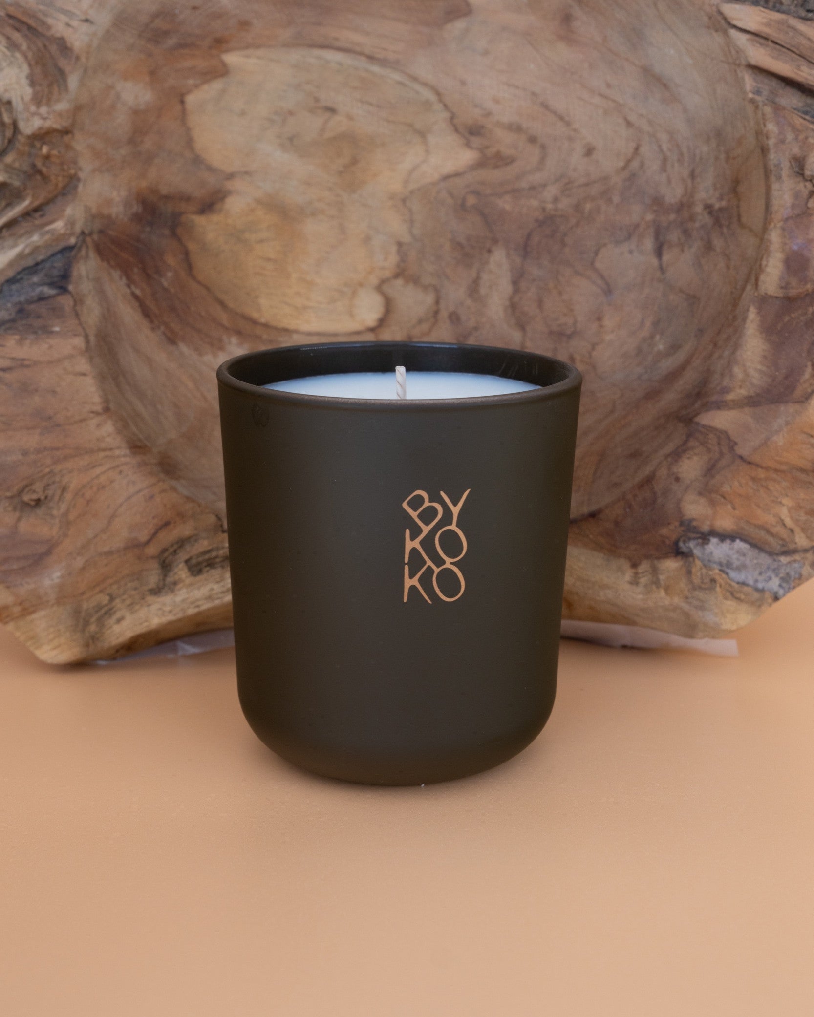BYKOKO Swiss Chalet scented candle on a wooden backdrop