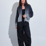 Model wearing the C~RUSH Dip Toto zip jacket in grey ombré with black trousers