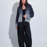 Model wearing the C~RUSH Dip Toto zip jacket in grey ombré with black trousers
