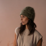 COLORUSH Byron beanie in Kiwi, side view with a beige knit top