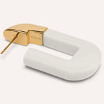 Coluri Lorde link earrings in snow white with gold posts – laid flat