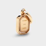 Coluri Talisman charm with a scarlet stone in gold, back view
