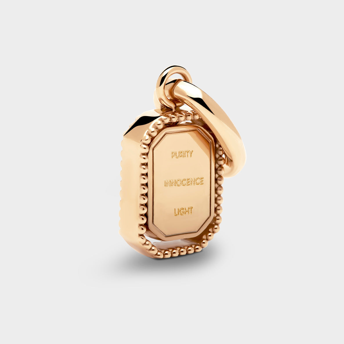 Coluri Talisman charm with a snow-white stone in gold, back view