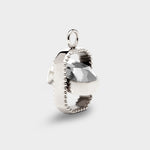 Coluri Talisman charm with a snow-white stone in silver, side view