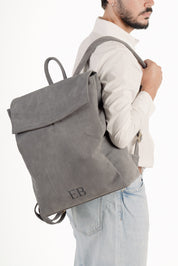 Man wearing Emmy Boo Backpack Lipari in grey suede crust leather  with personal monogram - Made in Italy