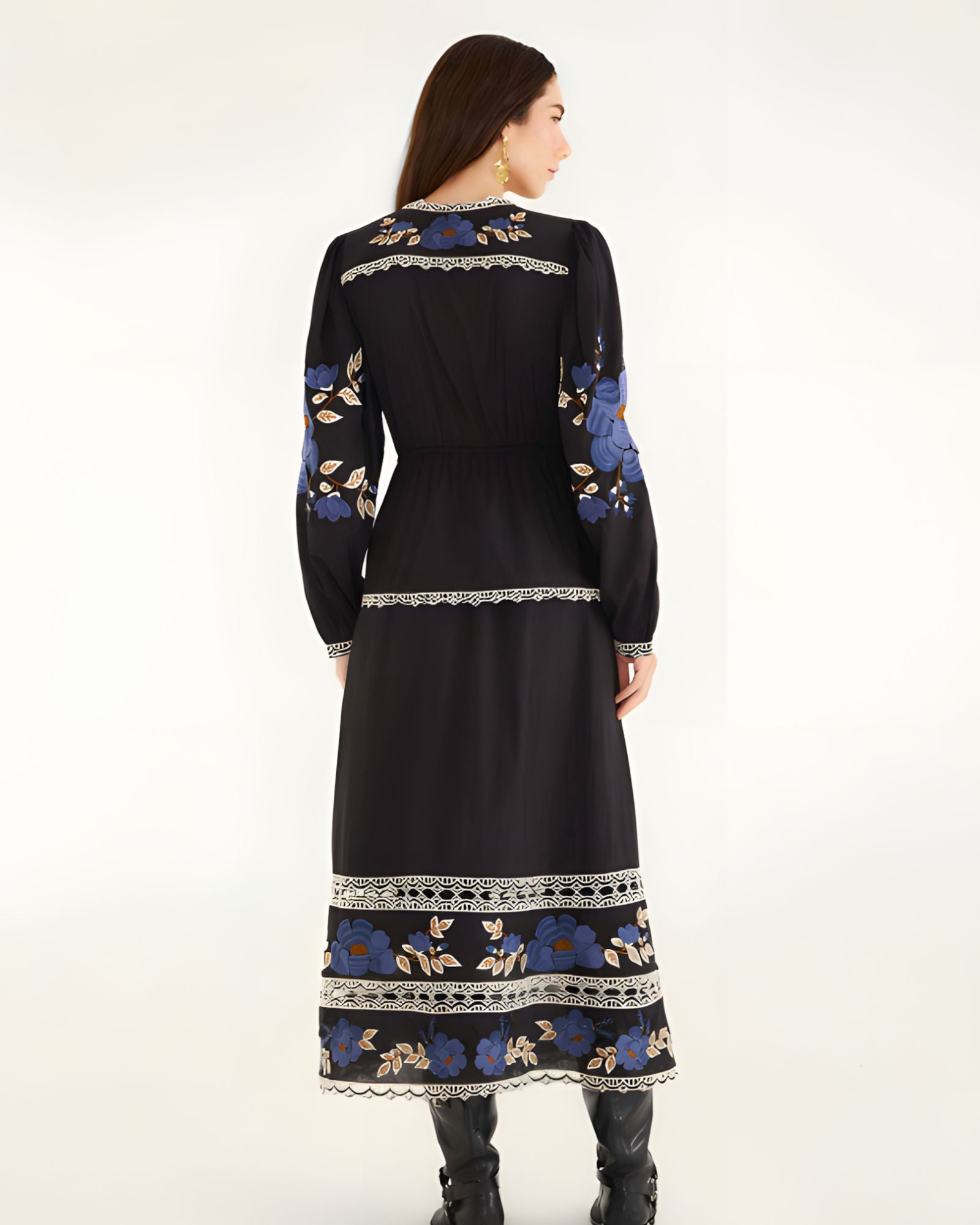 Full-length back view of the Farm Rio printed midi dress, showcasing the continuous embroidered patterns along the hem and sleeves.