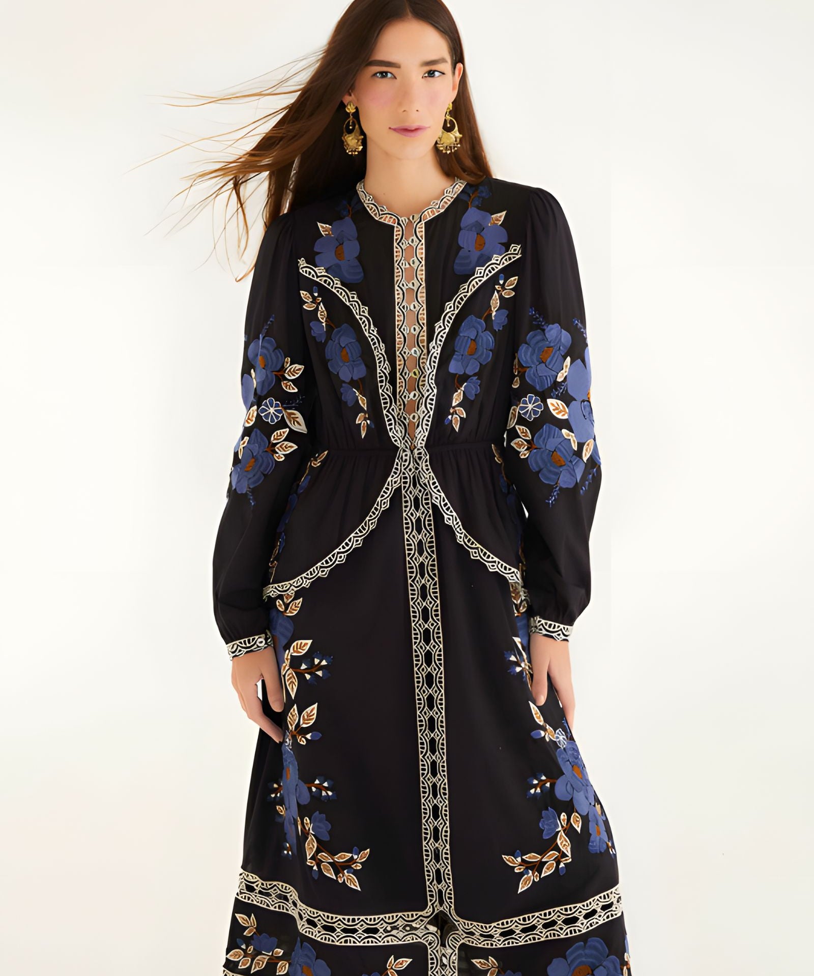 Full-length front view of a model wearing the Farm Rio Black Bold Flowers midi dress featuring blue floral embroidery and cream lace details.