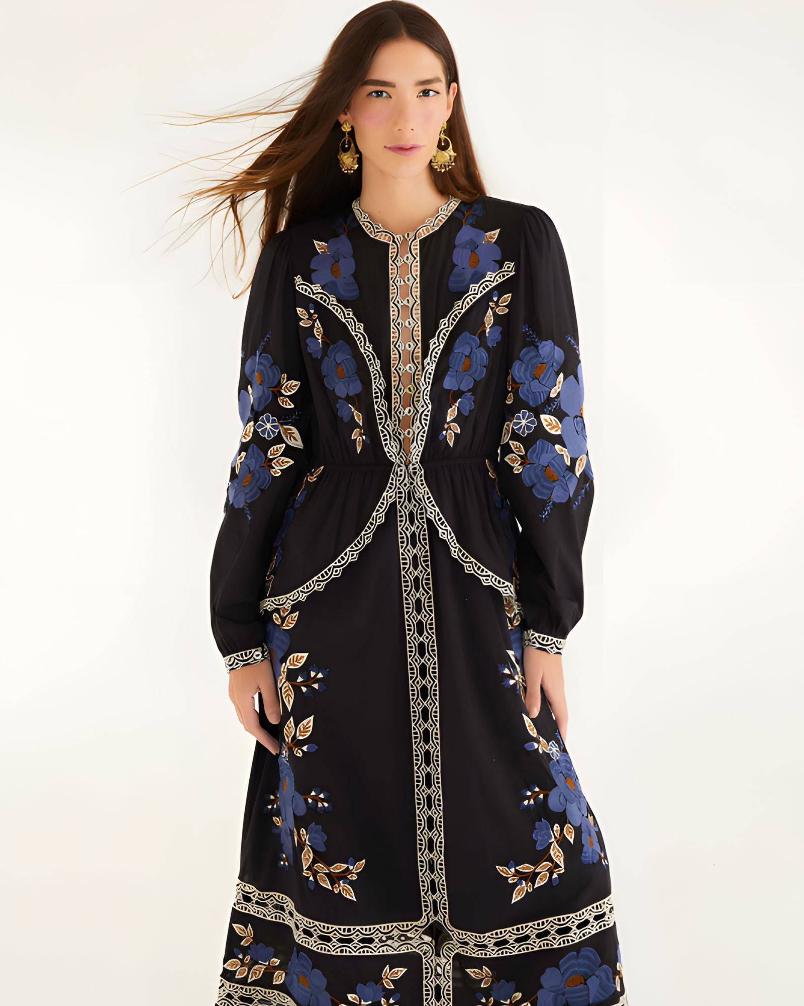 Full-length front view of a model wearing the Farm Rio Black Bold Flowers midi dress featuring blue floral embroidery and cream lace details.