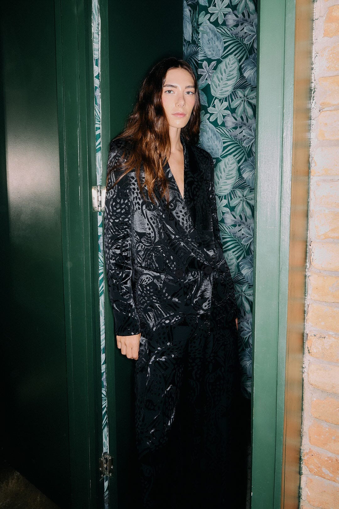 Woman wearing the Farm Rio black leopard blazer for an evening event look.