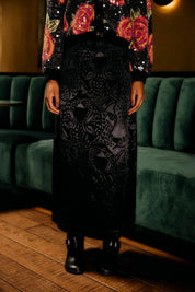 Full view of the floor-length black leopard jacquard skirt by Farm Rio