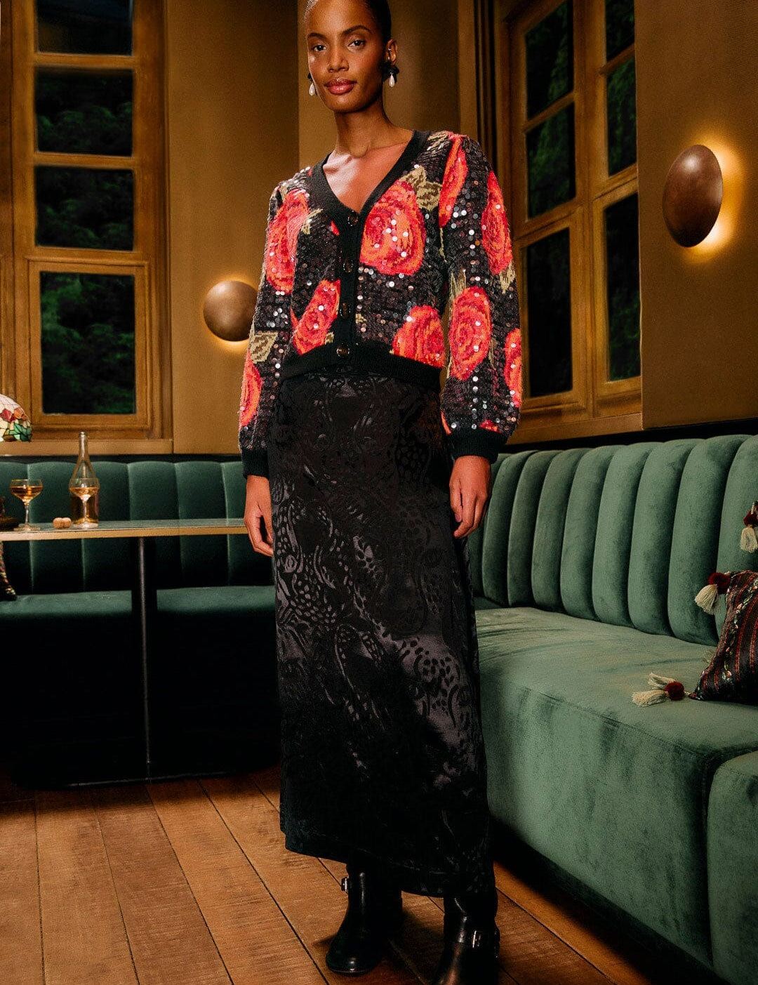 Woman wearing the Farm Rio black leopard jacquard maxi skirt in a stylish evening setting