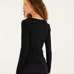 Back view of the FARM Rio black long-sleeved jersey blouse, smooth fitted back