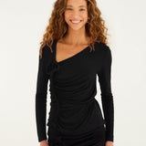 FARM Rio black long-sleeved jersey blouse with asymmetric neckline, ruched front and fabric rosettes, worn by a model