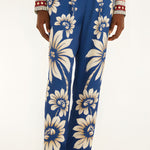 Close-up view of the Farm Rio Blue Luna pajama pants, highlighting the flowing wide-leg hem and contrast printed borders.